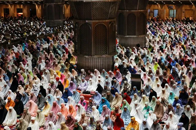 Muslim women attend mass prayers known as “Tarawih” during the first eve of holy fasting month of Ramadan at the Great Mosque of Istiqlal in Jakarta, Indonesia on March 22, 2023. (Photo by Willy Kurniawan/Reuters)