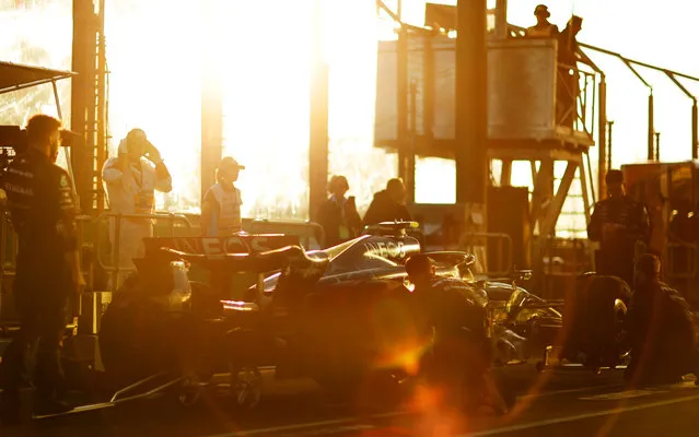 Lewis Hamilton of Great Britain driving the (44) Mercedes AMG Petronas F1 Team W14 prepares for a restart with his team in the pit lane after a red flag during the F1 Grand Prix of Australia at Albert Park Grand Prix Circuit on April 02, 2023 in Melbourne, Australia. (Photo by Dan Istitene – Formula 1/Formula 1 via Getty Images)