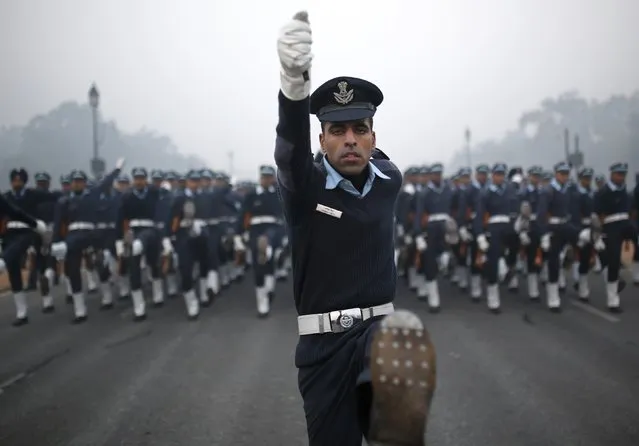 Indian Air Force soldiers rehearse for the Republic Day parade on a cold and foggy winter morning in New Delhi December 30, 2014. India will celebrate its annual Republic Day on January 26. (Photo by Ahmad Masood/Reuters)
