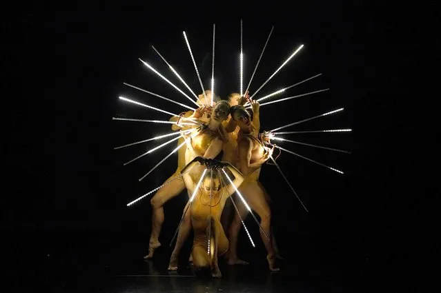 MOMIX dancers perform a scene from “Light Reigns” during a performance of Back to MOMIX at the Queens Theatre in New York April 23, 2023. MOMIX, a dance company based in Washington, Connecticut, was founded in 1981 by Choreographer Moses Pendleton. (Photo by Timothy A. Clary/AFP Photo)