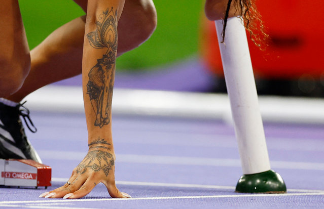 The tattoos of Argentina’s Teresita Daiana Briozzi during the women’s T47 400m heats at Stade de France in Saint-Denis, France on August 30, 2024. (Photo by Stéphanie Lecocq/Reuters)