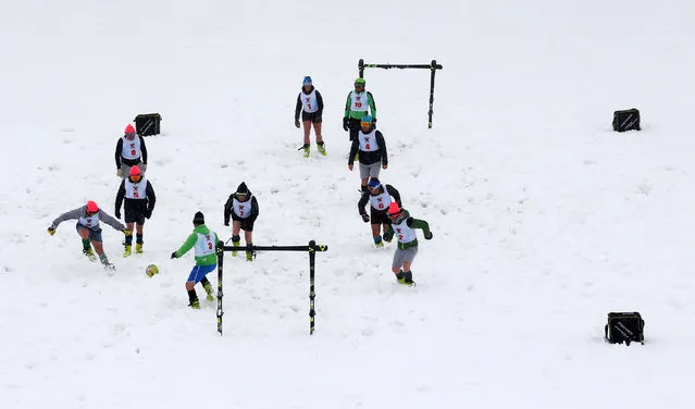 Ski club teachers play soccer in the snow wearing ski boots in Sestriere, Italy, May 14, 2018. (Photo by Stefano Rellandini/Reuters)