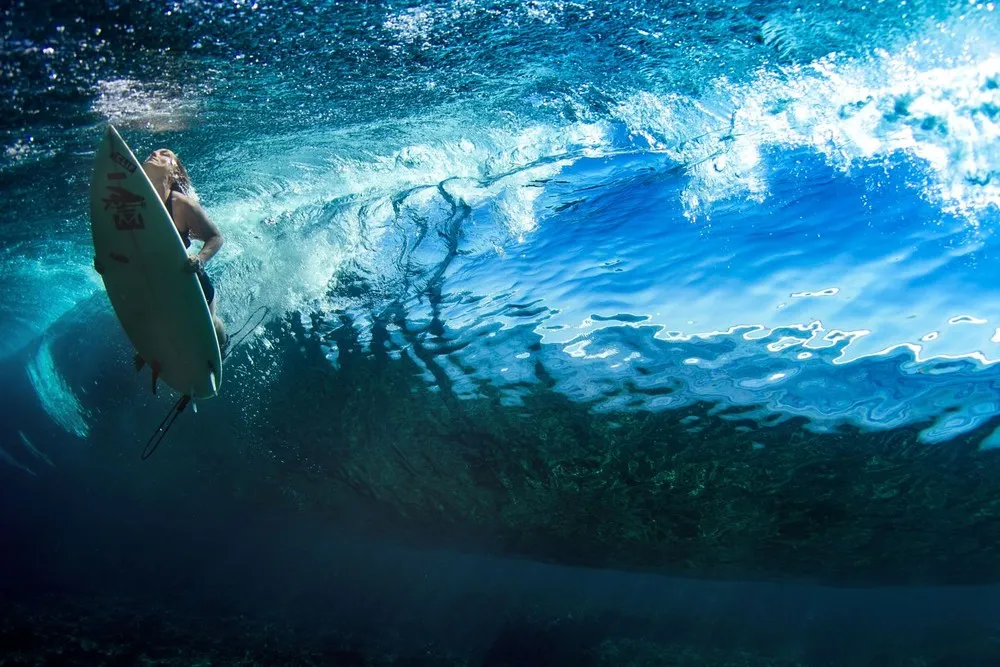 Female Surfers Beneath the Waves