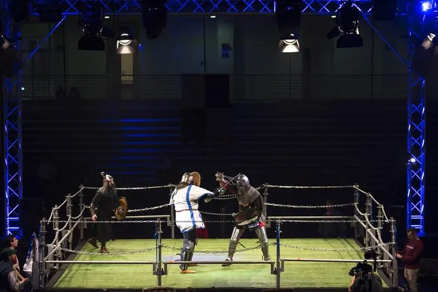 An Israeli competitor (L) fights an Estonian competitor during the “World Medieval Fighting Championship – the Israeli Challenge” in Rishon Letzion near Tel Aviv on January 22, 2015. (Photo by Amir Cohen/Reuters)