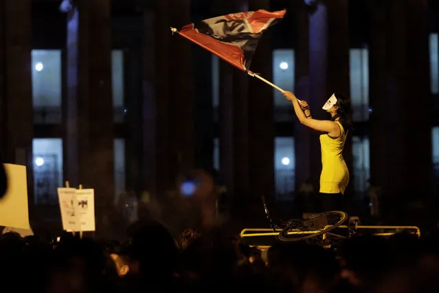 A woman waves a flag as she takes part in a protest against the killing of social activists, in Bogota, Colombia July 6, 2018. (Photo by Luisa Gonzalez/Reuters)