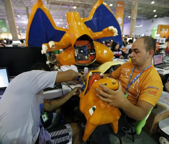 Participants work on a customised computer at Campus Party event in Sao Paulo February 4, 2015. Campus Party is an annual week-long, 24-hour technology festival that gathers around 8,000 hackers, developers, gamers and computer enthusiasts from around the world. (Photo by Paulo Whitaker/Reuters)