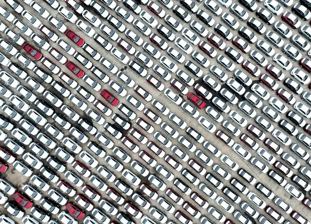 This photo taken on July 12, 2023 shows cars waiting to be loaded onto a ship at Lianyungang Port, in China’s eastern Jiangsu province. (Photo by AFP Photo/China Stringer Network)