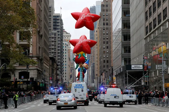 A squad of New York Police Department cars follow the 90th Macy's Thanksgiving Day Parade in Manhattan, New York, U.S., November 24, 2016. (Photo by Andrew Kelly/Reuters)