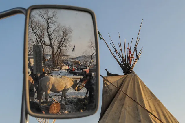 Horses are seen in a mirror in Oceti Sakowin camp as “water protectors” continue to demonstrate against plans to pass the Dakota Access pipeline near the Standing Rock Indian Reservation, near Cannon Ball, North Dakota, U.S. December 3, 2016. (Photo by Stephanie Keith/Reuters)