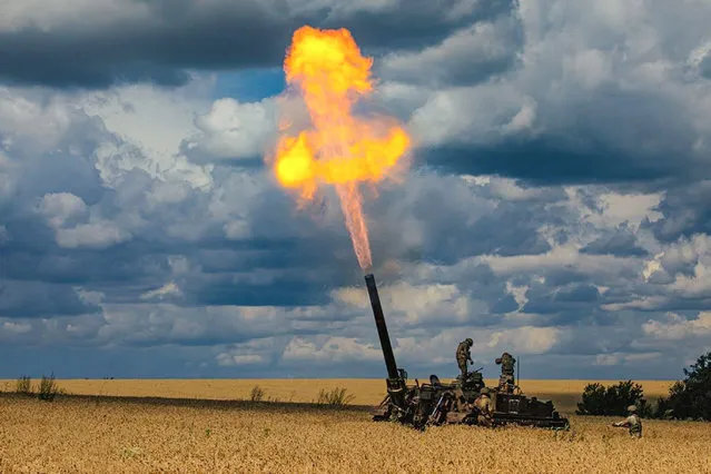In this photo released by the Russian defence ministry press service, Russian soldiers fire a 2S4 Tyulpan self-propelled heavy mortar from their position at an undisclosed location in Ukraine on July 2022. (Photo by AP Photo)