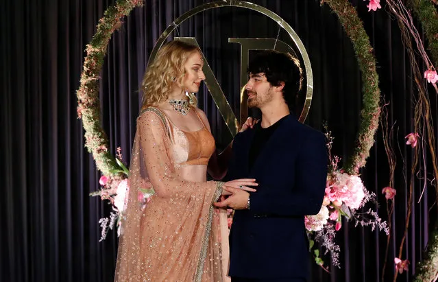 Actor Sophie Turner and singer Joe Jonas pose during a photo opportunity at the wedding reception of Bollywood actor Priyanka Chopra and singer Nick Jonas, in New Delhi, December 4, 2018. (Photo by Adnan Abidi/Reuters)