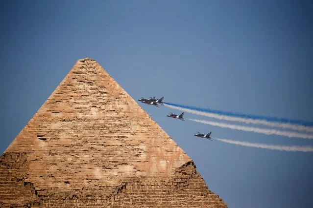 Aircrafts participate in Pyramids Air Show 2022 where Egyptian Air Forces' “Silver Stars” aerobatics perform along with the South Korean “Black Eagles” aerobatic team, at the Pyramids Plateau in Giza, Egypt on August 3, 2022. (Photo by Amr Abdallah Dalsh/Reuters)