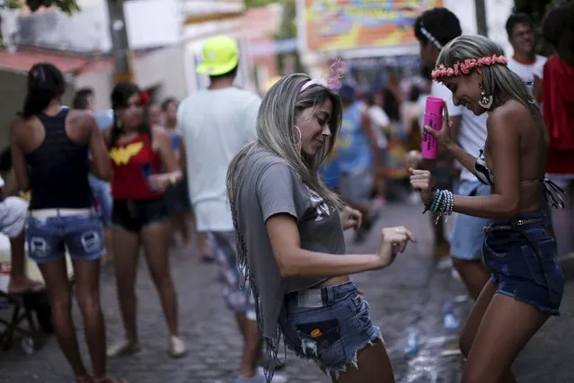 Revellers attend a carnival party in a neighborhood in Olinda, Brazil February 7, 2016. (Photo by Ueslei Marcelino/Reuters)