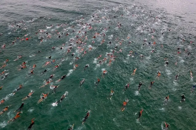 Athletes start the men's and women's open water swimming competition during Rei e Rainha do Mar 2023 at Copacabana beach on December 10, 2023 in Rio de Janeiro, Brazil. (Photo by Buda Mendes/Getty Images)
