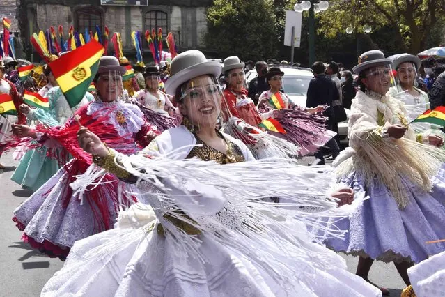 Morenada dancers dance at the Plaza de Armas during the celebrations of the Morenada National Day in La Paz, on September 7, 2021. (Photo by Aizar Raldes/AFP Photo)