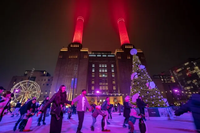 Battersea Power Station Ice Rink in London, United Kingdom on November 13, 2022. Running until 8th Jan. 2023, a large outdoor ice-rink outside the power station and next to the riverside brings in festive Christmas fun with vivid illumination. (Photo by Guy Corbishley/Alamy Live News)