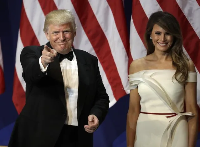 President Donald Trump arrives with first lady Melania Trump, at The Salute To Our Armed Services Inaugural Ball in Washington, Friday, January 20, 2017. (Photo by David J. Phillip/AP Photo)