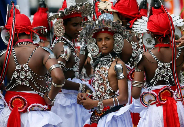 School boys who attend Sri Lankan traditional dance training wait for their graduation ceremony at a Buddhist temple in Colombo, Sri Lanka January 23, 2017. (Photo by Dinuka Liyanawatte/Reuters)