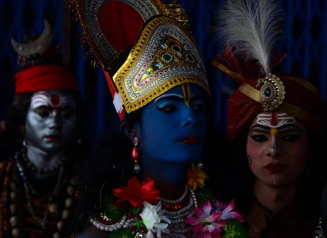 Indian artists, dressed as various hindu God characters, perform with human skull and bones, during Maha ShivaRatri festival,celebrated in reverence of the God Shiva,married to Hindu Goddess Parvati, in the old city of Allahabad on March 4,2019. Hindu devotees mark the Maha Shivaratri festival by offering special prayers and fasting to worship the deity Shiva. (Photo by Ritesh Shukla/NurPhoto via Getty Images)