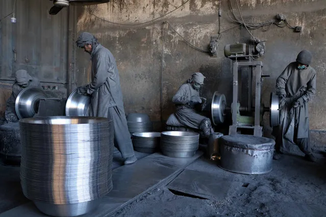 Laborers work at an aluminum factory in Herat, Afghanistan, 21 January 2019. Some 120 laborers work at the factory that produces four tons of Aluminum daily. (Photo by Jalil Rezayee/EPA/EFE)
