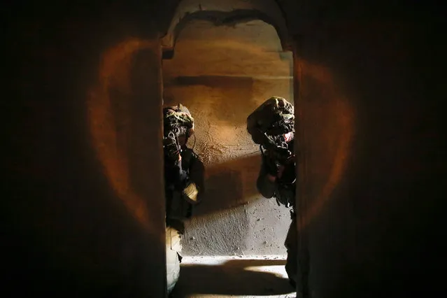 Israeli soldiers from the Nahal Infantry Brigade wear night vision devices inside an underground tunnel as they take part in an urban warfare drill at an army base near Arad, southern Israel February 8, 2017. (Photo by Amir Cohen/Reuters)