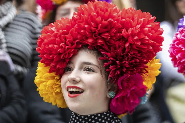 A participants wears a hat during the Easter Parade and Bonnet Festival, Sunday, April 21, 2019 in New York. (Photo by Jeenah Moon/AP Photo)