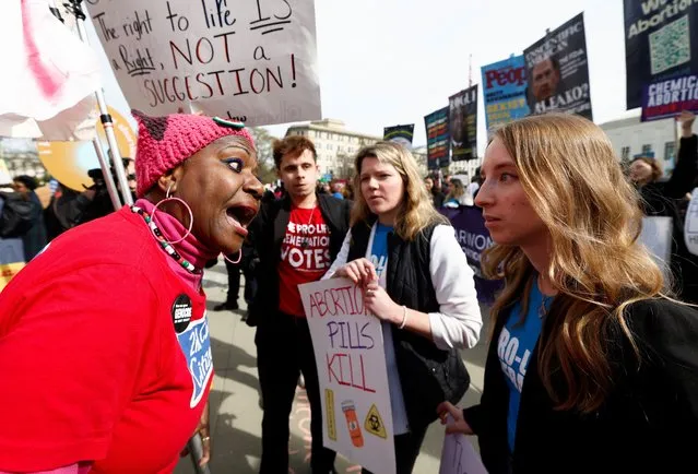 Anti abortion protesters and demonstrators for abortion rights argue during a protest outside the U.S. Supreme Court as justices hear oral arguments in a bid by President Joe Biden's administration to preserve broad access to the abortion pill, in Washington, on March 26, 2024. (Photo by Evelyn Hockstein/Reuters)