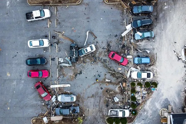 An aerial view of a destroyed cars in Mayfield, Kentucky, on December 15, 2021, five days after tornadoes hit the area. (Photo by Chandan Khanna/AFP Photo)