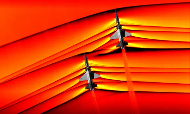An undated handout photo made available by NASA photo shows two T-38 aircrafts in supersonic speed with shockwaves around them, at NASA’s Armstrong Flight Research Center in Edwards, California, USA, Issued 07 March 2019. According to press release, NASA has successfully tested an advanced air-to-air photographic technology that captured the first ever images of the interaction of shockwaves from two T-38 supersonic aircrafts in flight. When aircrafts fly faster than the speed of sound, shockwaves travel away from it and is heard on the ground as a sonic boom, this imagery will allow researchers to study these shockwaves in an effort to make sonic booms quieter which may open future possibilities for supersonic flight over land. The images are originally monochromatic and shown here as colorized composite images. (Photo by Photo by EPA/EFE/NASA)