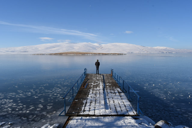 A view of Lake Cildir after its surface frozen due to nipping cold in Kars, Turkey on December 29, 2021. (Photo by Ismail Kaplan/Anadolu Agency via Getty Images)
