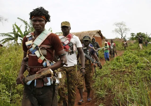 Members of the anti-balaka, a Christian militia, patrol outside the village of Zawa April 8, 2014. (Photo by Goran Tomasevic/Reuters)