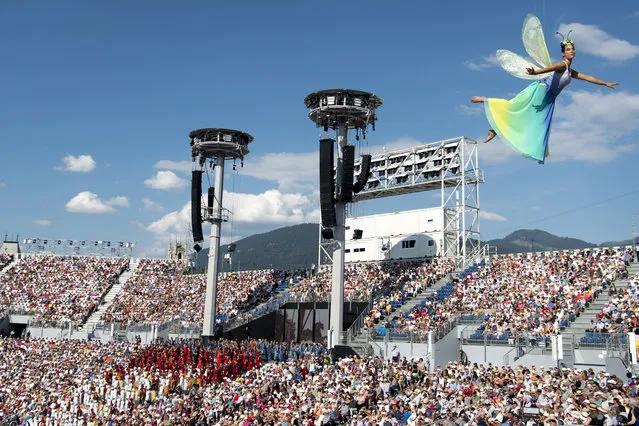 An extra in the arena of the “Fete des Vignerons” (winegrowers' festival in French), during the last rehearsal in Vevey, Switzerland, 17 July 2019. Organized by the brotherhood of winegrowers, the event will celebrate winemaking from 18 July to 11 August. The arena has a capacity of 20,000 spectators and hosts a giant central LED floor of approximately 800 square meters. (Photo by Laurent Gillieron/EPA/EFE)