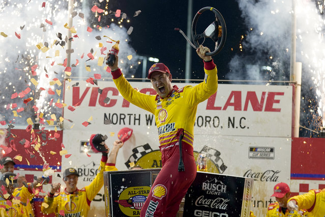 Joey Logano celebrates in Victory Lane after winning the NASCAR All-Star auto race at North Wilkesboro Speedway in North Wilkesboro, N.C., Sunday, May 19, 2024. (Photo by Chuck Burton/AP Photo)