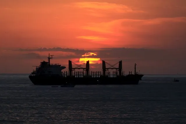 A freighter lies off the coast at sunrise in Algiers, Algeria June 25, 2015. (Photo by Ramzi Boudina/Reuters)