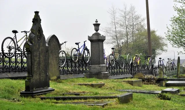 A line of bicycles are left on the railings of a cemetery in Calderdale, as residents prepare for the The Tour de France will pass through on Sunday July 6th on the York to Sheffield stage. (Photo by John Giles/PA Wire)