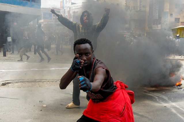 A man gestures during a demonstration over police killings of people protesting against the imposition of tax hikes by the government, in Nairobi, Kenya on July 2, 2024. (Photo by Monicah Mwangi/Reuters)