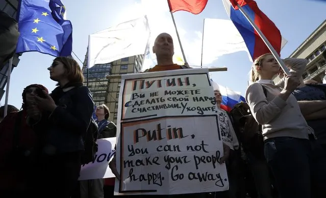 A Russian opposition supporter holds banner during a rally in Moscow, Russia, May 6, 2017. (Photo by Tatyana Makeyeva/Reuters)