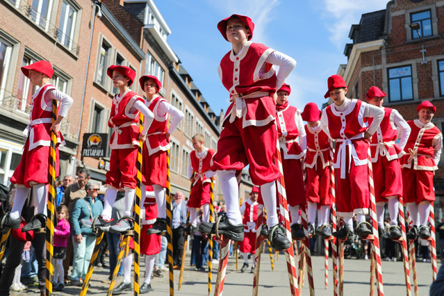 Stilt walkers take part in a parade during a folklore festival in Namur, Belgium, April 15, 2023. The 25th Namur folk festival was held here to promote and protect local traditional culture. (Photo by Xinhua News Agency/Rex Features/Shutterstock)