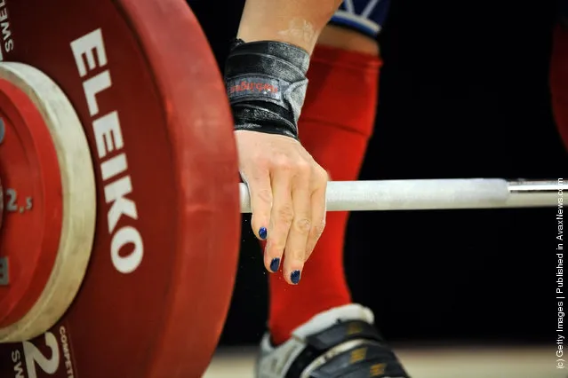 Jacquelynn Berube grasps the bar before attempting a 68 kilogram snatch during the 2012 U.S. Olympic Team Trials for Women's Weightlifting