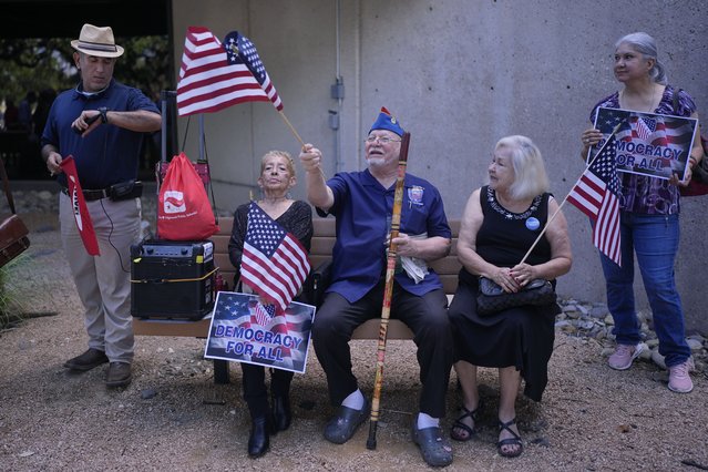 Roman Rena waves a flag where the League of United Latin American Citizens’ officials held a news conference to respond to allegations of voter fraud by the state’s attorney general, in San Antonio, Texas, August 26, 2024. (Photo by Eric Gay/AP Photo)