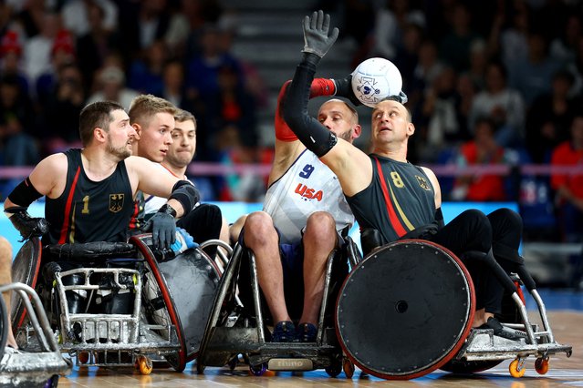 Marco Herbst and Steffen Wecke of Germany in action against Eric Newby of United States during wheelchair rugby in Paris, France on August 31, 2024. (Photo by Rula Rouhana/Reuters)