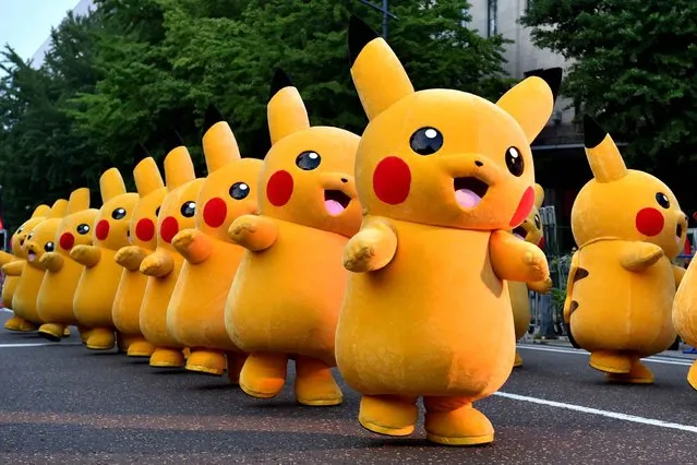 Costumed performers as Pikachu, the popular animation Pokemon series character, perform at the Yokohama Dance Parade in Yokohama on August 2, 2015. The dance began on August 1 and will run for 65 days throughout the city, with more than 200 dance programmes. (Photo by Kazuhiro Nogi/AFP Photo)