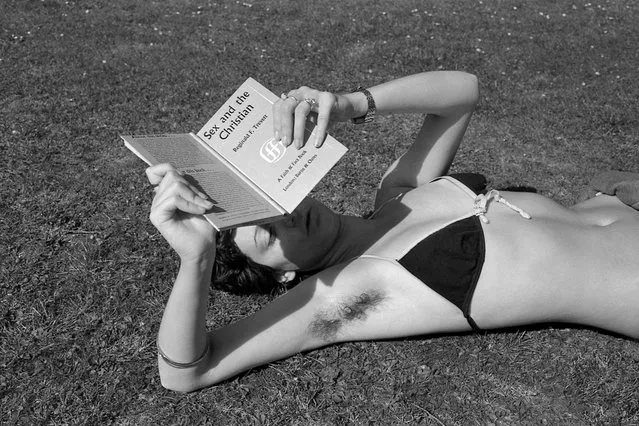 “I came across this girl in the Oxford University parks, lying in the summer sun reading a book. It was in the late-60s, not a laptop in sight. It was surprising to find an unshaven armpit, almost as shocking as pubic hair. It’s from The Oxford Pictures, my first photographic essay. It was very much a young man’s vision: anxiety, desire and sexual guilt run right through it, maybe because of my strict upbringing with Sunday school lessons and Christian teaching. It might have been the swinging 60s, with lots of photos in the papers of girls in miniskirts and Mick Jagger in a white dress, but plenty of people felt they were missing out – that this sexual revolution was somewhere else, out of reach. We felt the barriers rather than the freedoms. So I looked for visual moments that reflected my sense of being an outsider: isolated figures beside the river, or sitting on a park bench”. (Photo by Paddy Summerfield)