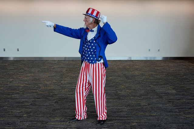 A man dressed as Uncle Sam gestures, on the day Republican presidential nominee former U.S. President Donald Trump holds a campaign rally in Erie, Pennsylvania, U.S., September 29, 2024. (Photo by Brian Snyder/Reuters)