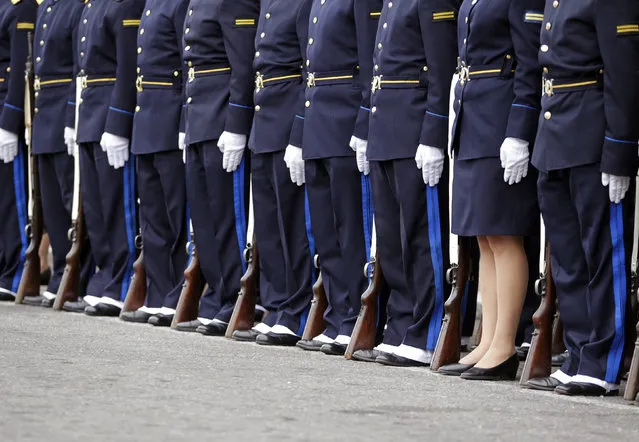 Police officers participate in a parade during the celebration of the 183rd anniversary of the Uruguayan Police Force in downtown Montevideo, Uruguay December 18, 2012. (Photo by Andres Stapff/Reuters)