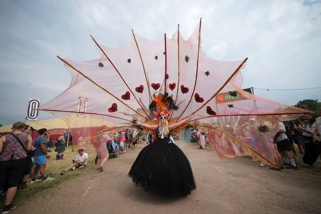 Notting Hill Carnival performers take part in the parade during the Glastonbury Festival at Worthy Farm in Somerset on Thursday, June 23, 2022. (Photo by Yui Mok/PA Images via Getty Images)