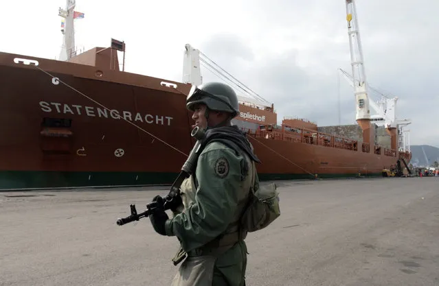 In this March 21, 2009, file photo, a soldier patrols at the seaport in Puerto Cabello, Venezuela after late President Hugo Chavez ordered naval vessels and military personnel to seize control of two of Venezuela's largest seaports, Puerto Cabello and Maracaibo ports. President Nicolas Maduro promoted Defense Minister Gen. Vladimir Padrino on July 2016, to head what is called the Great Mission of Sovereign Supply. The goal is to boost production and guarantee the smooth distribution of food in the face of what Maduro sees as economic sabotage by his opponents. As part of the overhaul, all ministries will take orders from Padrino, and the nation’s ports will fall under the “total control” of the military. (Photo by Howard Yanes/AP Photo)