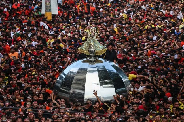 Filipino Catholic devotees parade the wooden statue of Our Lady of Penafrancia during a procession in Naga City, Camarines Sur province, Philippines, 16 September 2017 (issued 17 September 2017). Thousands of pilgrims, devotees and tourists converged for the traditional celebration of the feast of Bicolandia's patroness, the Virgin of Penafrancia, a 19th century religious rite held every September. (Photo by Basilio H. Sepe/EPA/EFE)