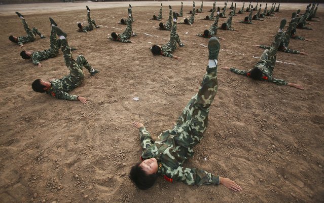 XINING, CHINA - AUGUST 8: (CHINA OUT) Members of a female grappling team from Qinghai Province armed police  undergo fistic exercises on August 8, 2006 in Xining of Qinghai Province, China. The female grappling team, established in May 2006, has 40 women soldiers aged 18 to 21. The training program includes grappling, boxing, dagger exercise and shooting.  (Photo by China Photos/Getty Images)