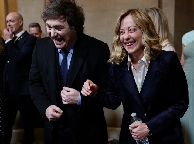 Italian Prime Minister Giorgia Meloni and Argentina's President Javier Milei share a joke on January 20, 2025. (Photo by Evelyn Hockstein/Reuters)